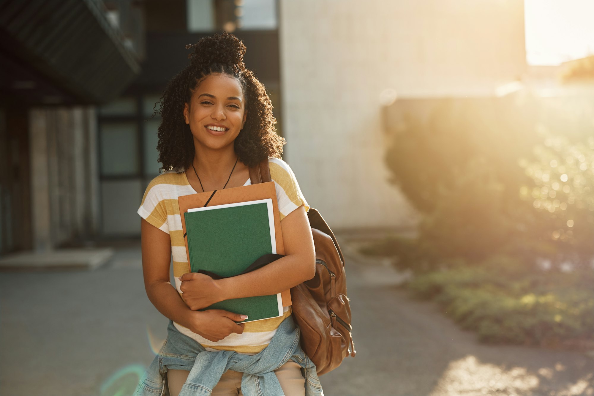 Portrait of black female student at campus looking at camera.